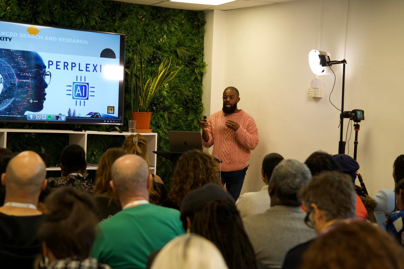 Gerald Vanderpuye teaching a packed AI workshop at Impact Brixton